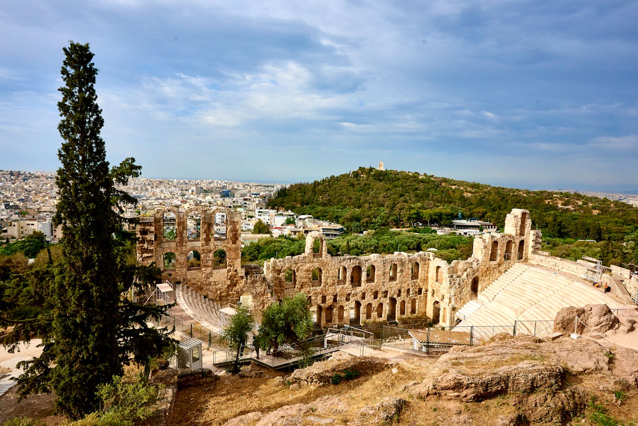 Historic Odeon of Herodes Atticus amphitheater in Athens, Greece, under a clear sky.